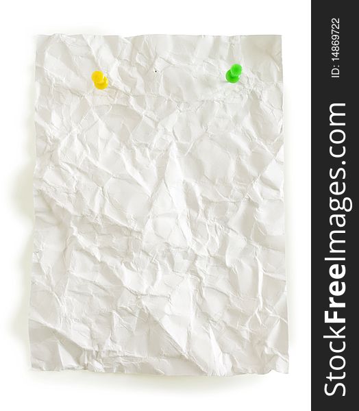 Crumpled page and color pushpins isolated in white