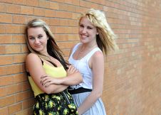 Girls Standing Next To Brick Wall Stock Photography Girls Standing Next To Brick Wall Stock Photography