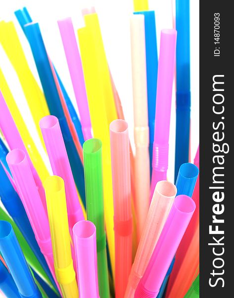 Colorful drinking straws on white