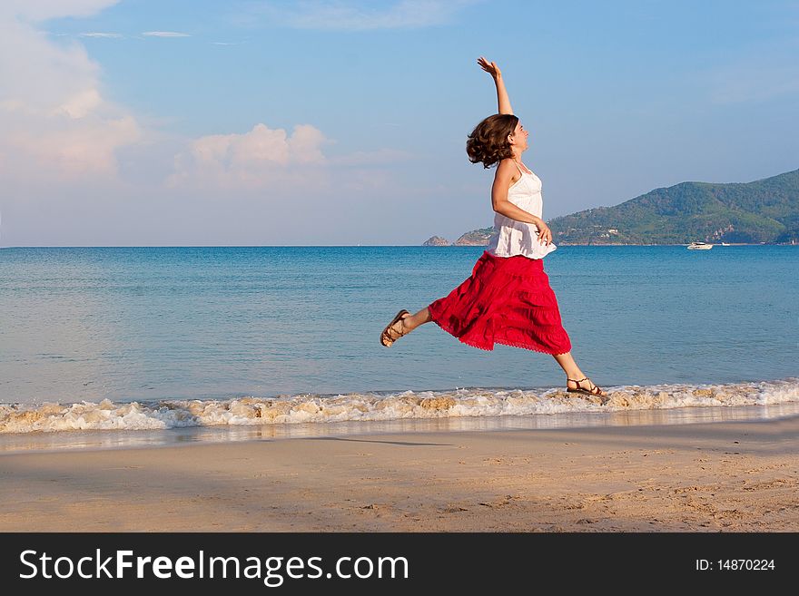 Girl runs at the sea