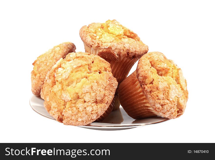 Four muffins on white plate