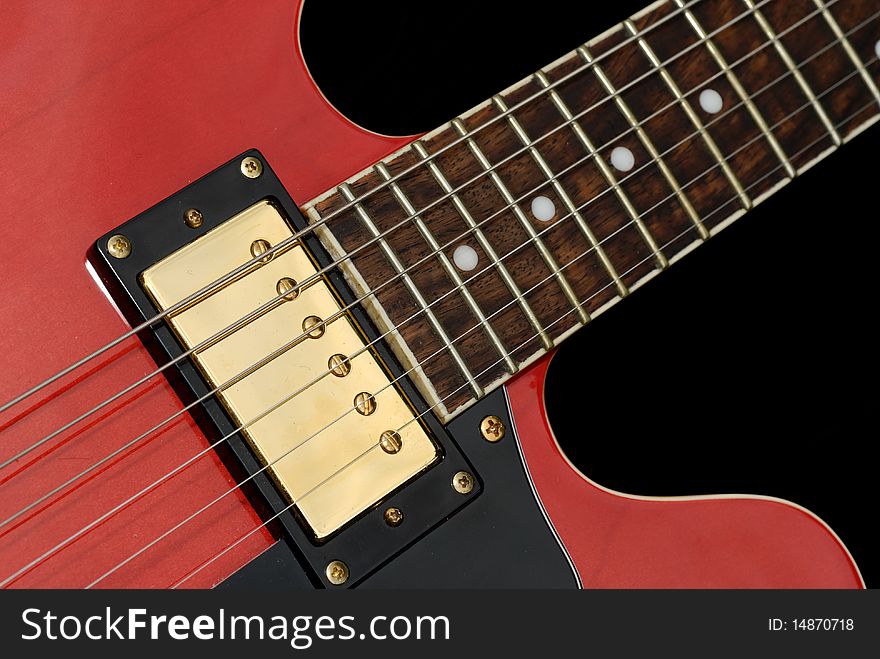 Close up of a red electric guitar. Close up of a red electric guitar