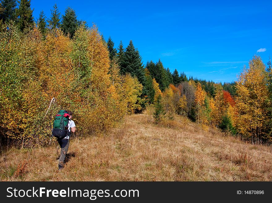 Hiker boy in autumn mountains. Hiker boy in autumn mountains