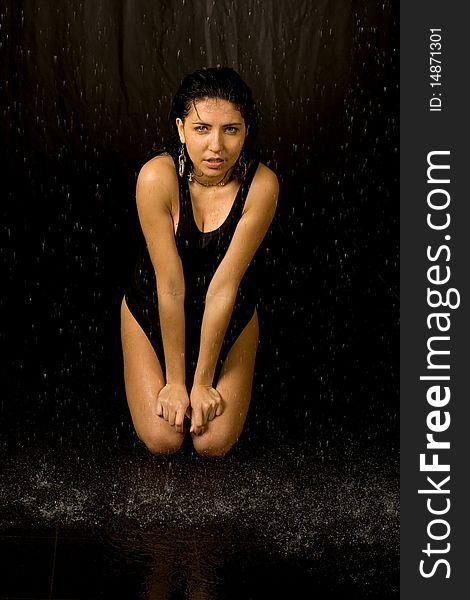 Full length portrait of a woman in water studio. Full length portrait of a woman in water studio