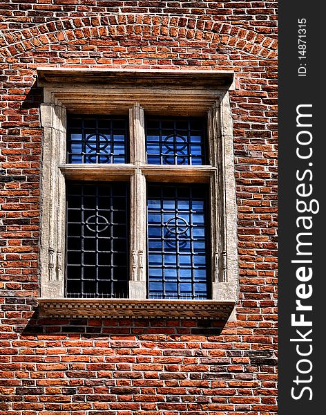 Window of a medieval building, very old brick wall