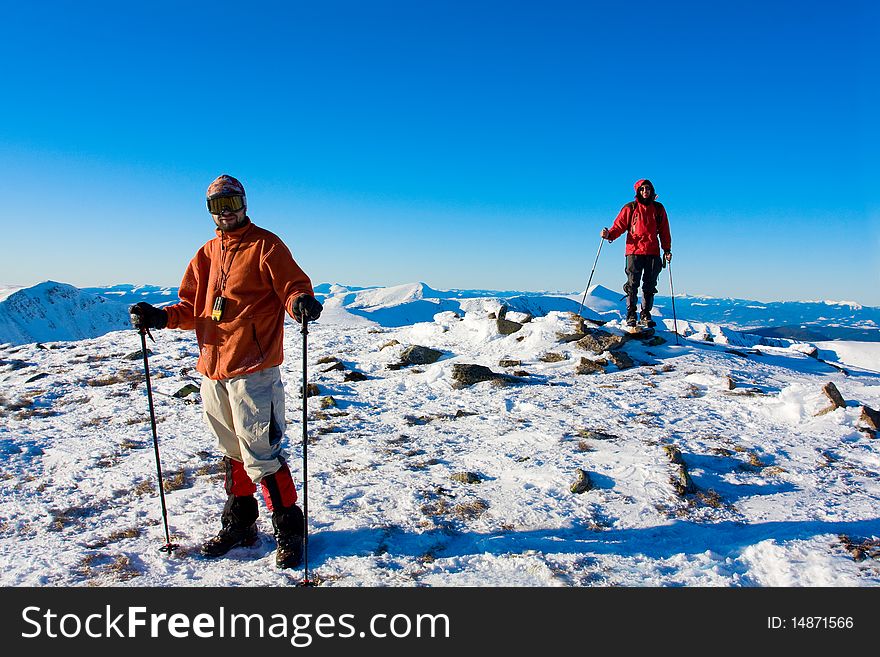 Hiker in winter in mountains