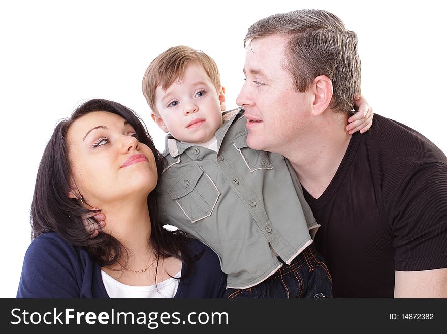 Joyful family. Father, mother look at boy. Isolated on white background. Joyful family. Father, mother look at boy. Isolated on white background