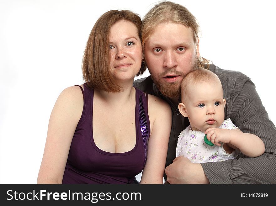 Beautiful young family: father, mother and baby isolated on white