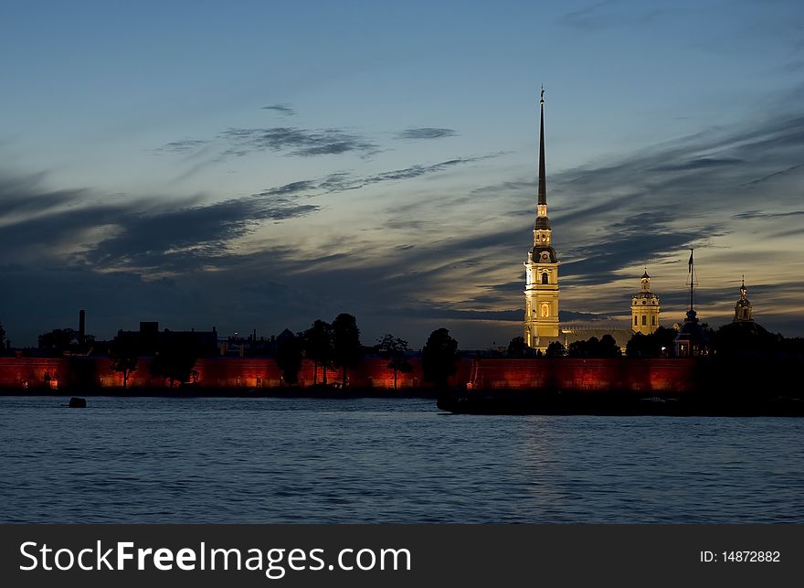 The silhouettes of Peter-and-Paul's Cathedral against the sunset and the Neva River. The silhouettes of Peter-and-Paul's Cathedral against the sunset and the Neva River.