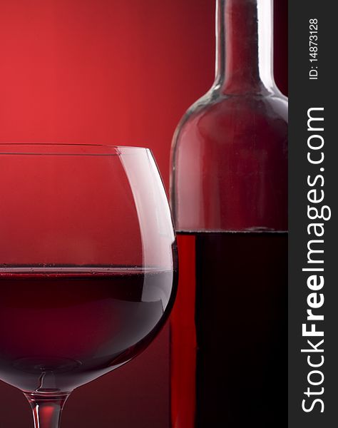 Red wine glass and bottle. Red wine glass and bottle