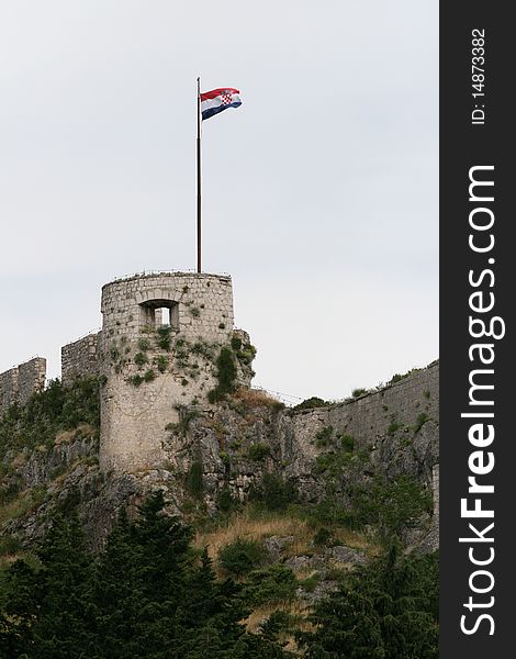 Tower of one of the strategically most important and most known fortresses in Croatian history, Klis Citadel, built in tenth century. Now must see attraction for tourists. Tower of one of the strategically most important and most known fortresses in Croatian history, Klis Citadel, built in tenth century. Now must see attraction for tourists