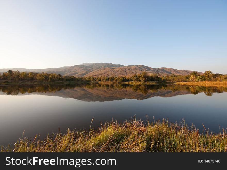 Mountain reflection in summer time