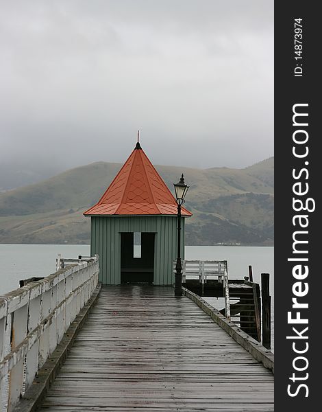 A rain swept wharf in the small town of Akaroa, New Zealand. A rain swept wharf in the small town of Akaroa, New Zealand.