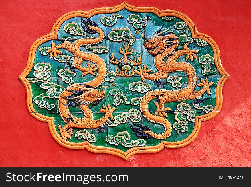 Yellow Dragon Ceramic Relief in Forbidden City in Red Wall, Forbidden City Emperor's Palace Beijing, China