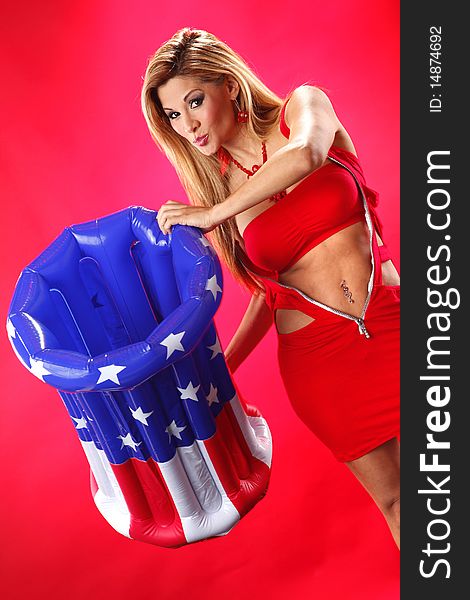 Blonde holds a patriotic container - For compositing your product popping out of the plastic can. Blonde holds a patriotic container - For compositing your product popping out of the plastic can