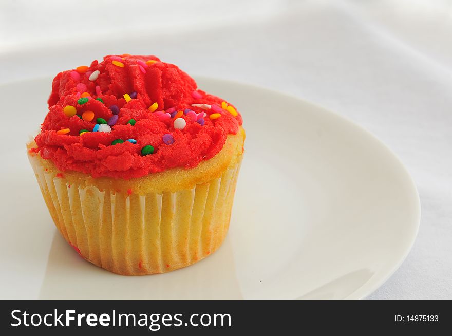 Red Cupcake On White Plate