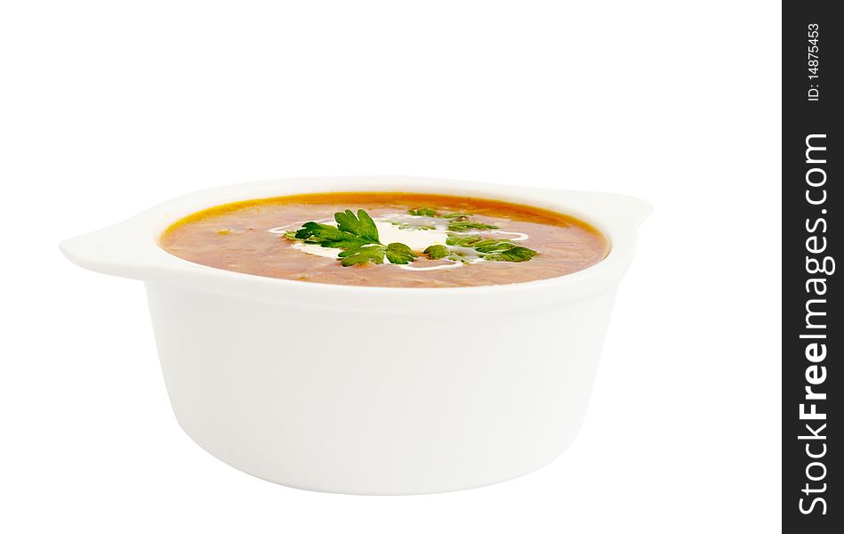 Plate with a borsch on a white background