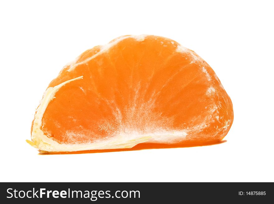 Segment of an orange orange (tangerine) removed close up. Segment of an orange orange (tangerine) removed close up