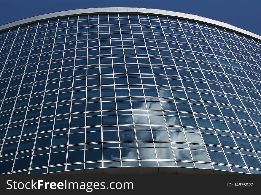 Reflection Of A Cloudy Sky In Glass Wall