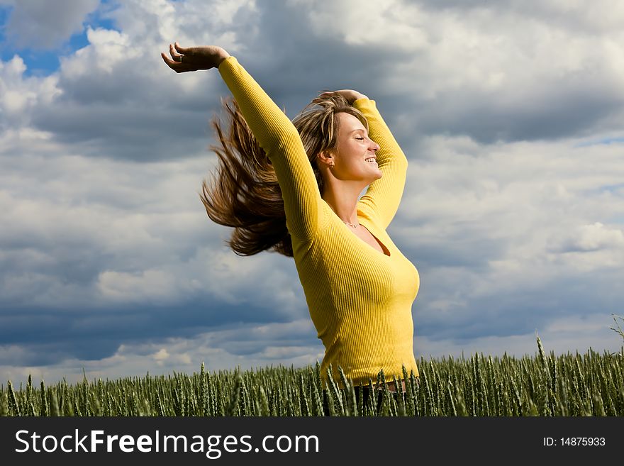 Active field running carefree female enjoying weather