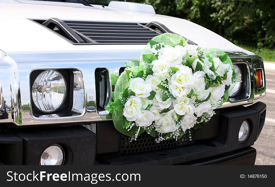 Car is decorated wedding flowers. Wedding.