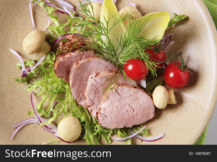 Thin slices of seasoned tenderloin and garnish. Thin slices of seasoned tenderloin and garnish