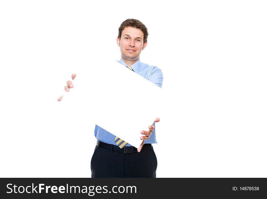 Young attractive businessman holds emty, blank copyspace card, studio shoot isolated on white background. Young attractive businessman holds emty, blank copyspace card, studio shoot isolated on white background