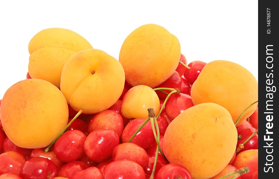 Sweet cherry and apricots on a white background