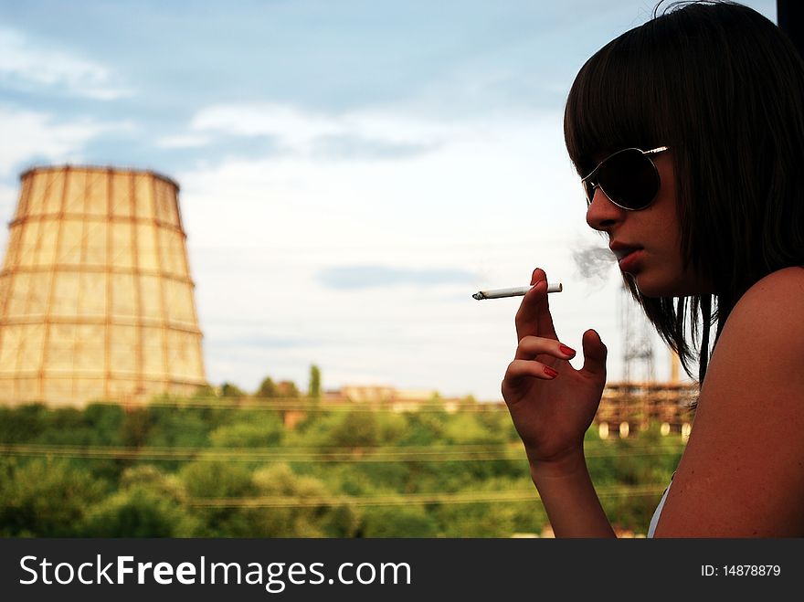 Portrait Of The Smoking Girl In Sunglasses