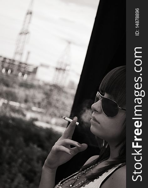 Portrait Of The Smoking Girl In Sunglasses