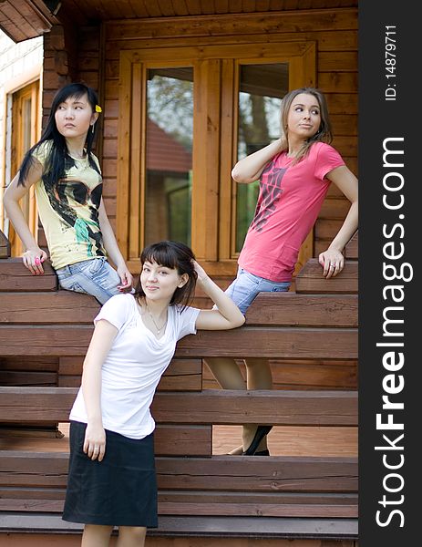 Three female friends on a veranda