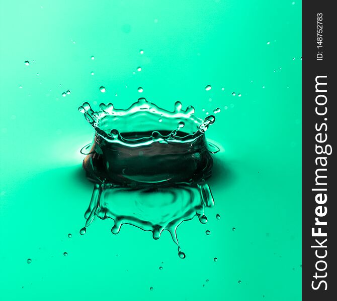 Close up of water droplet or splash-Image, green backgroung