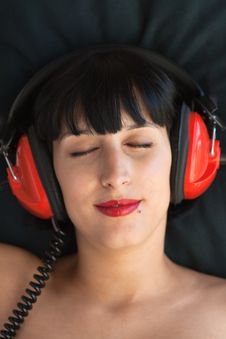 Woman Enjoys Music Stock Image