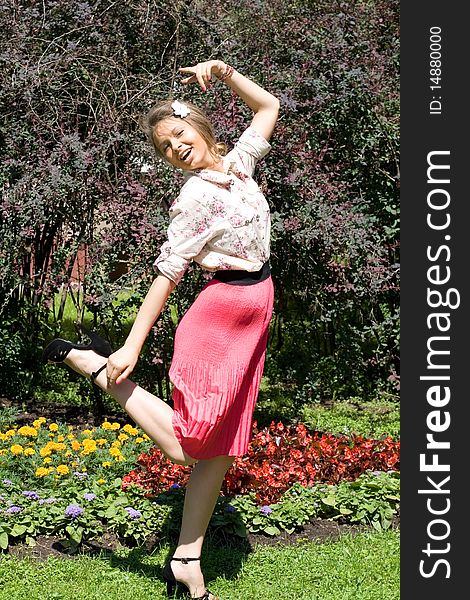 Girl standing near flowers