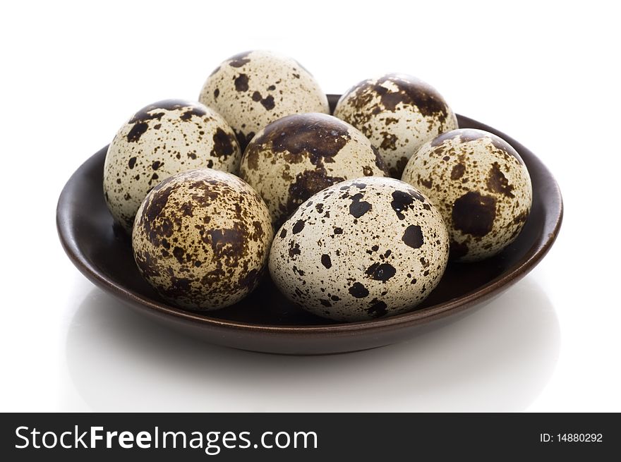 Quail eggs isolated on white