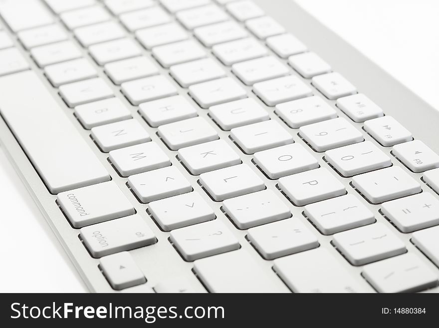 Closeup of keys on a modern wireless aluminum computer keyboard. Closeup of keys on a modern wireless aluminum computer keyboard