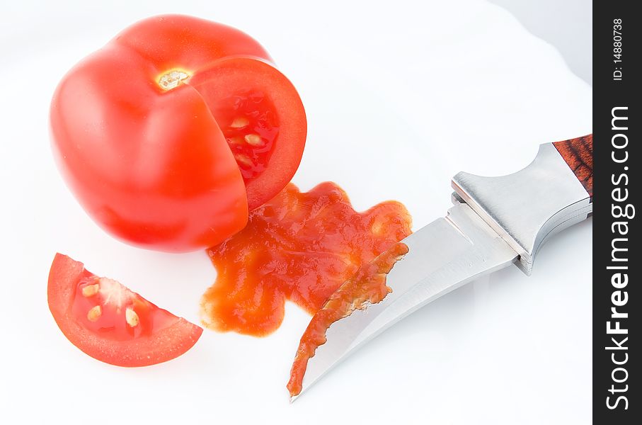 Tomato ketchup sauce with knife. Tomato blood funny theme
