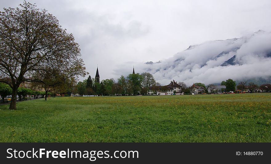 Switzerland, Interlaken,  view of the city and the mountains (alps) in cloudy weather