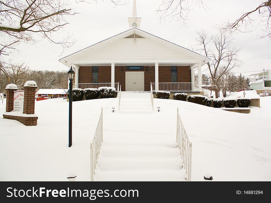 A church sitting on a blanket of snow. A church sitting on a blanket of snow.