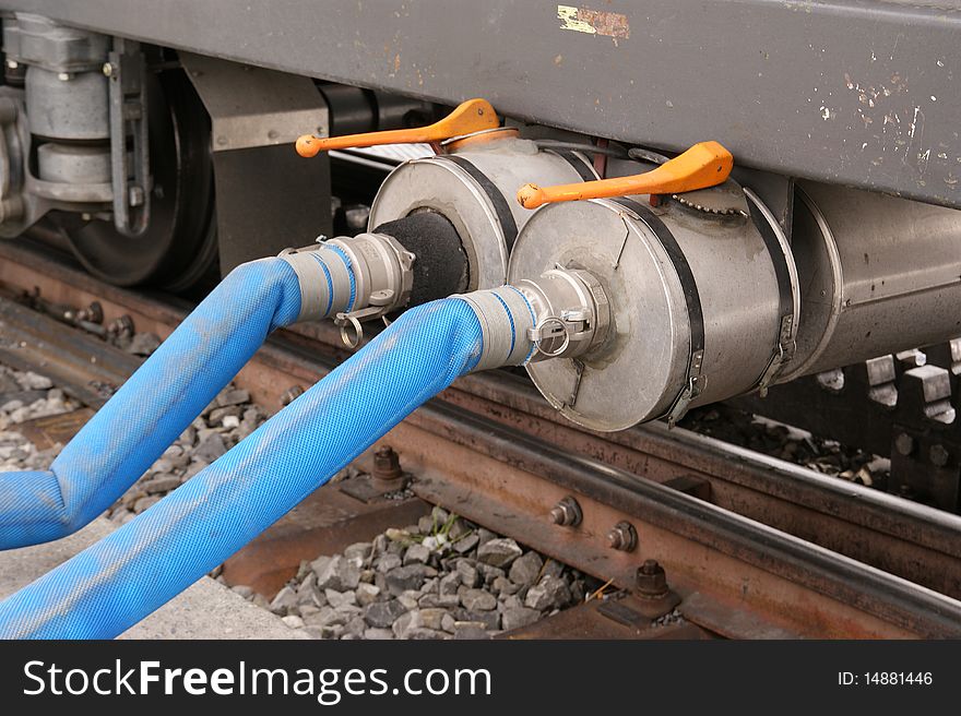 Refill the brake fluid in a railway carriage parked train