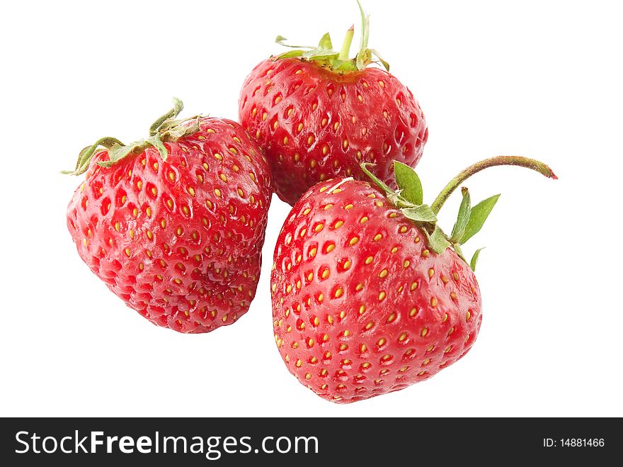 Three ripe strawberry on white