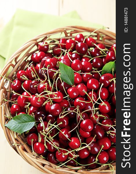 Fresh red cherries in a basket