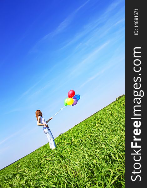 Girl and balloons on a blue background