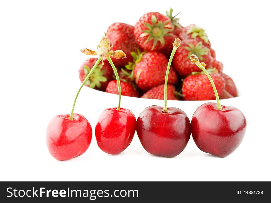 Ripe cherry on red strawberry background