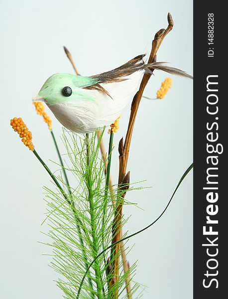 Decorative bird on branch on white background