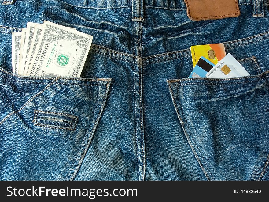 Money and credit cards in two back pocket