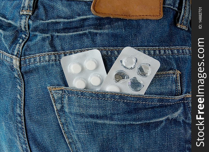 Pills in blue jeans pocket. Pills in blue jeans pocket