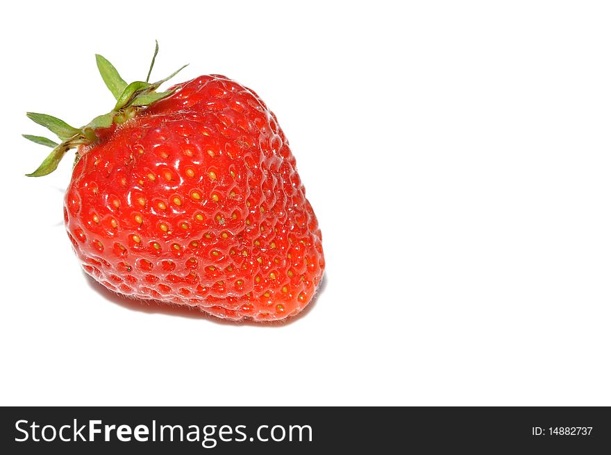 A fresh strawberry on a white background. A fresh strawberry on a white background