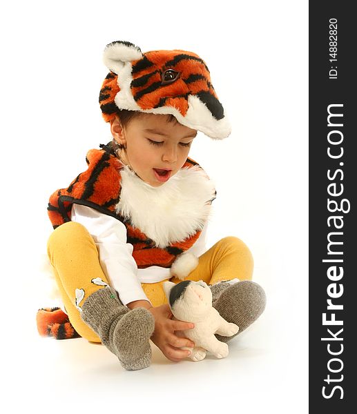 Little boy in fancy dress in the form of tiger on white background