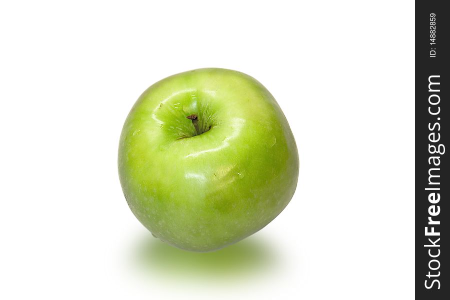 Juicy and ripe green apple closeup on a white background.